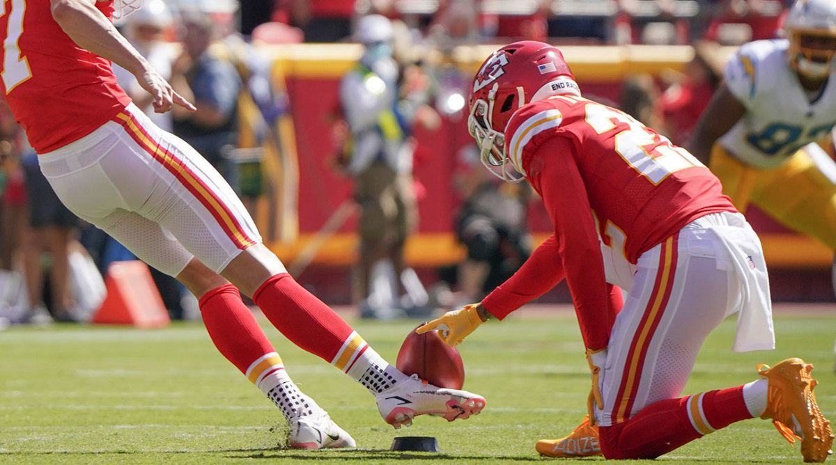 Chiefs kicker Harrison Butker kicks off.